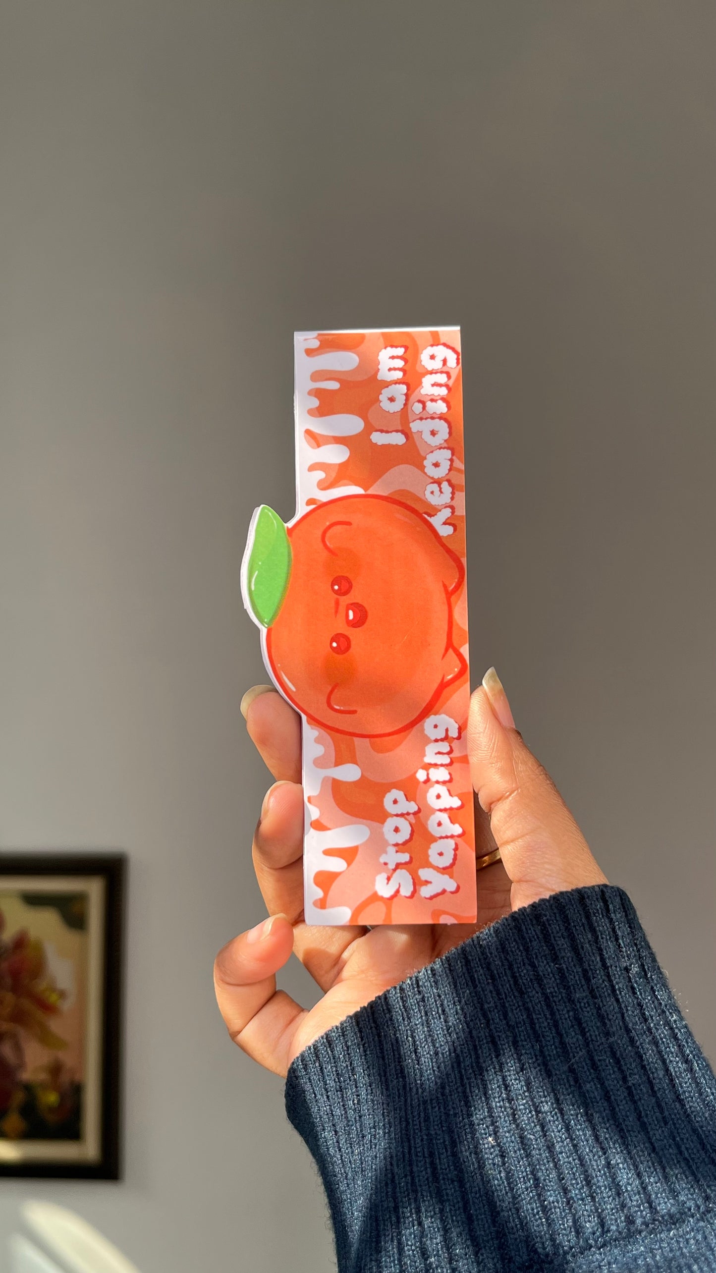 Orange reading guy magnetic bookmark