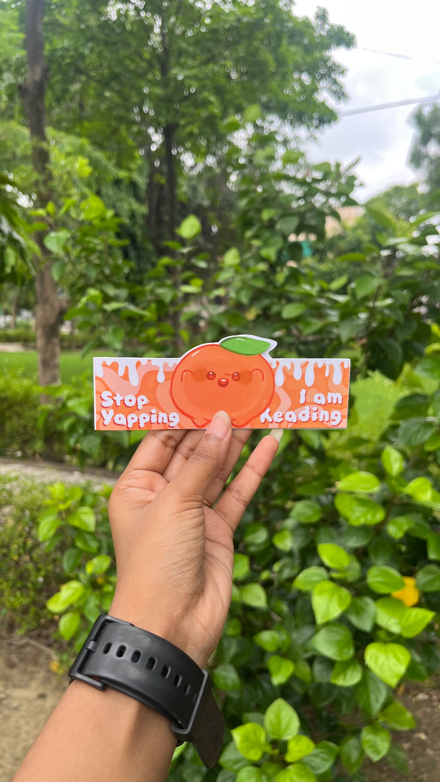 Orange reading guy magnetic bookmark