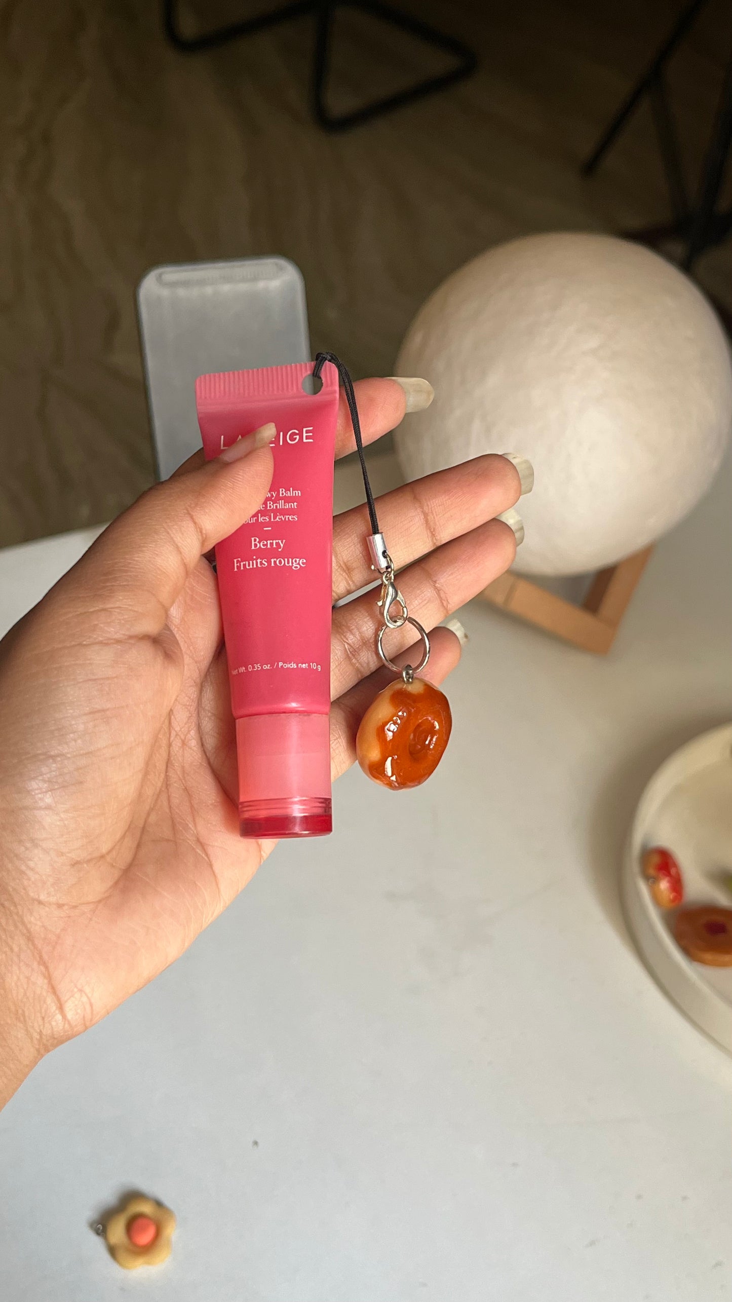 Donut with chocolate syrup charm