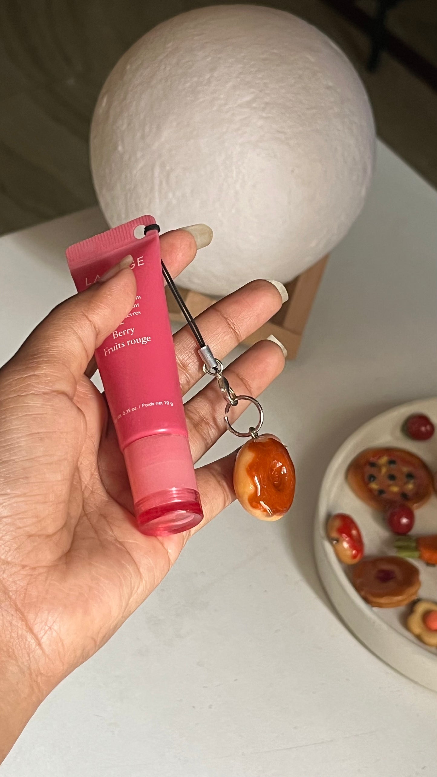 Donut with chocolate syrup charm