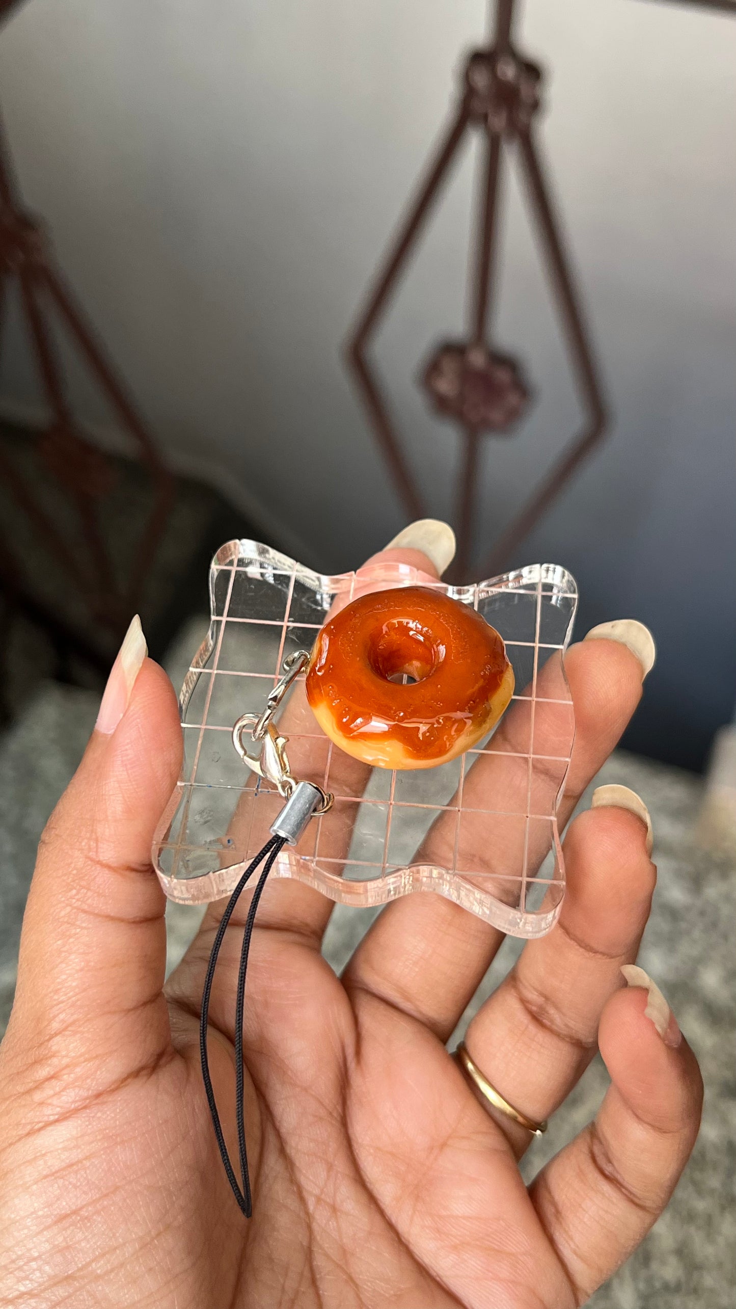 Donut with chocolate syrup charm